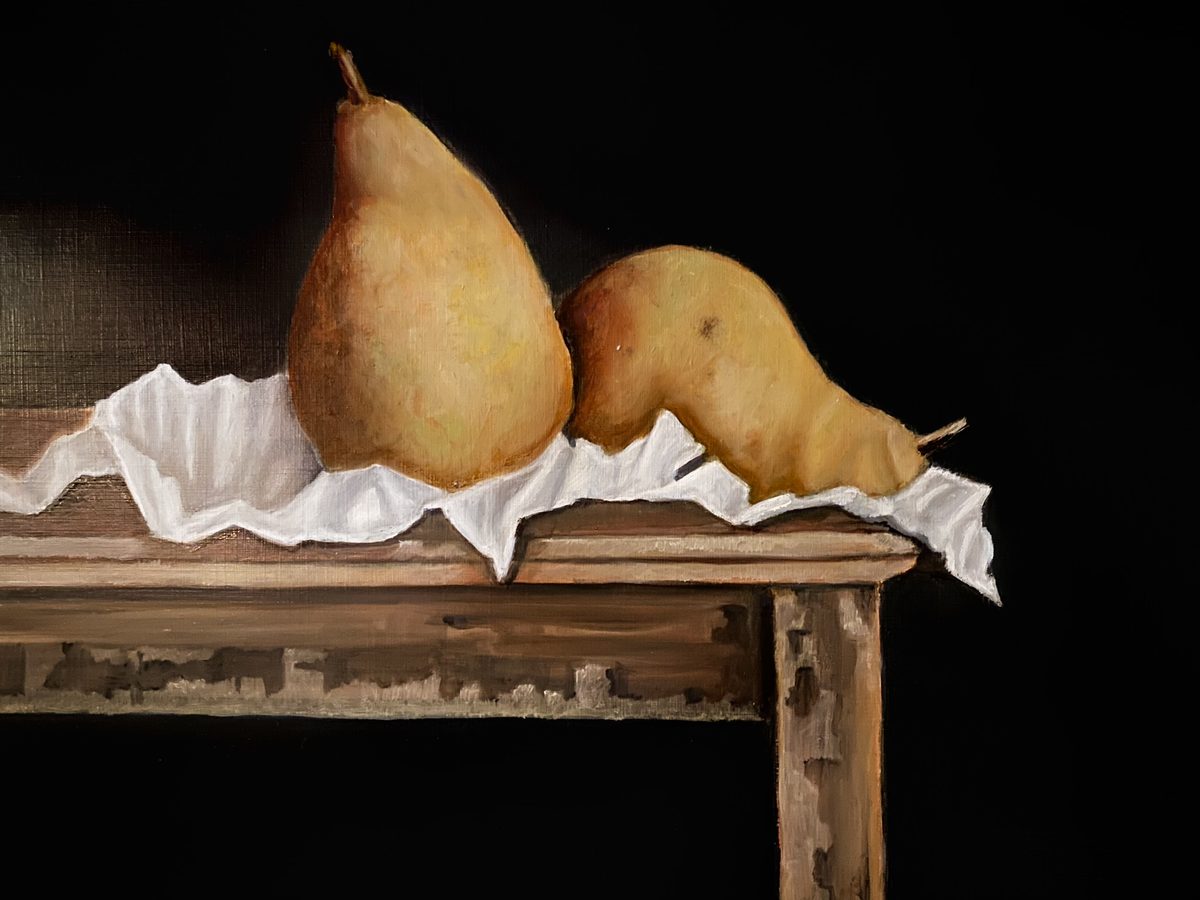 Still life of two pears on a wooden stool