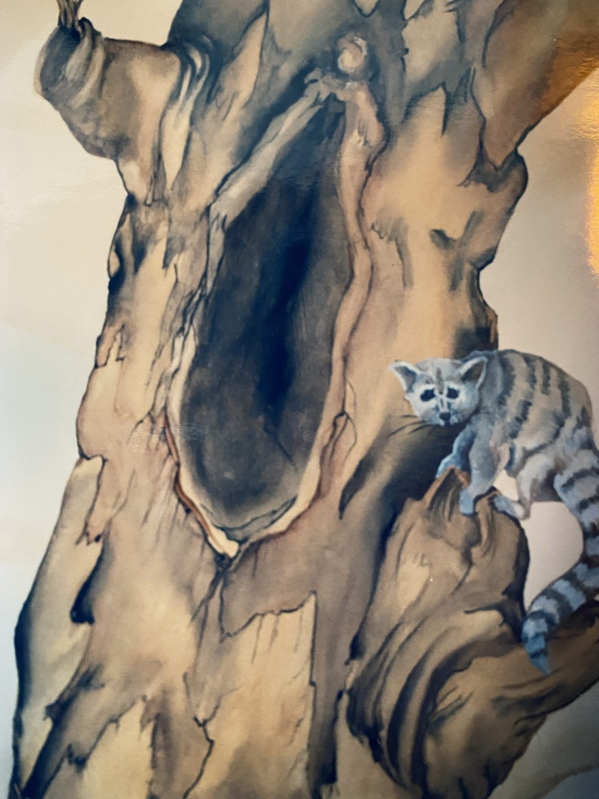 Mural detail: a tree hollow with a cat