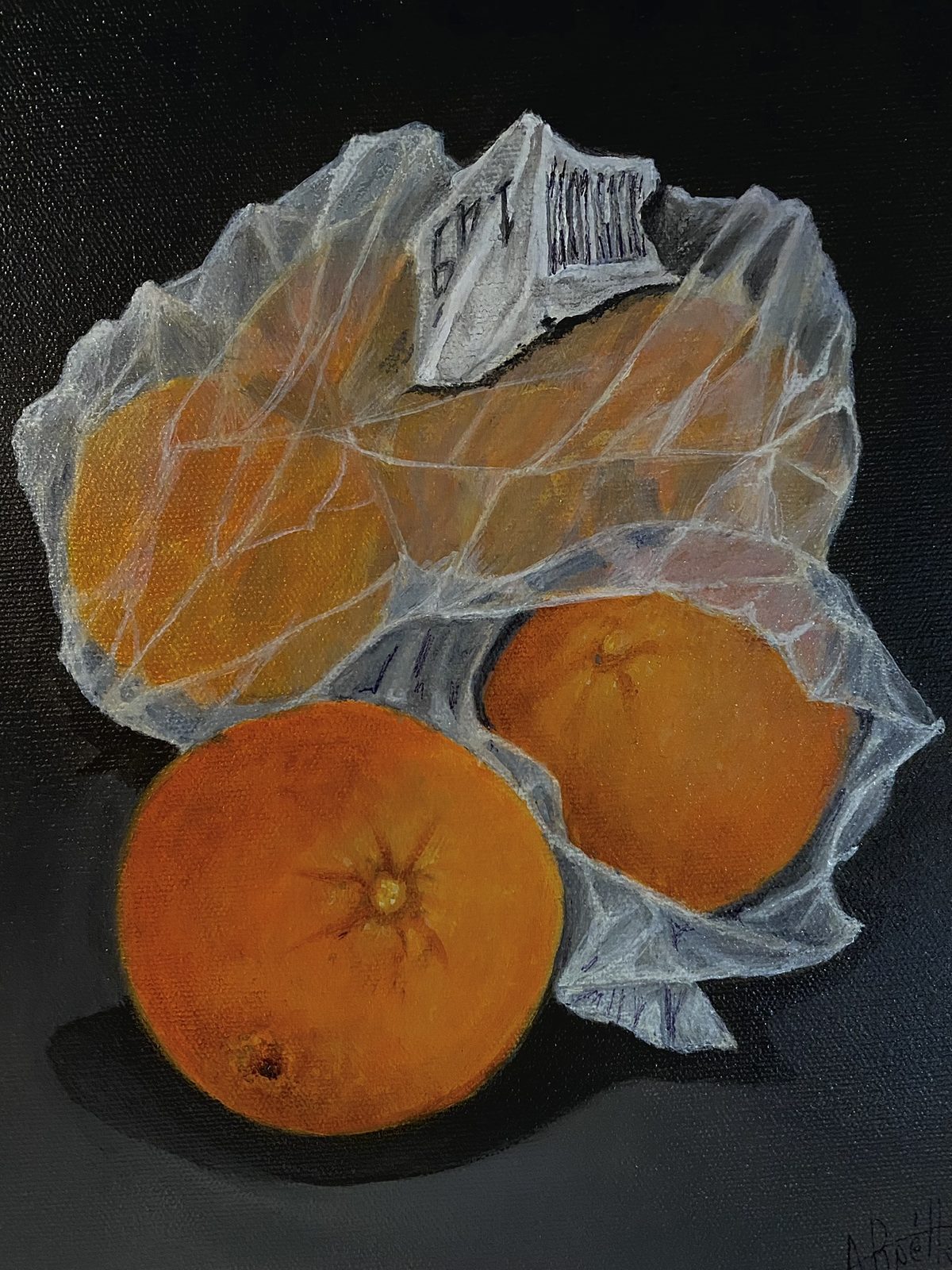 Still life of oranges in a plastic bag on black