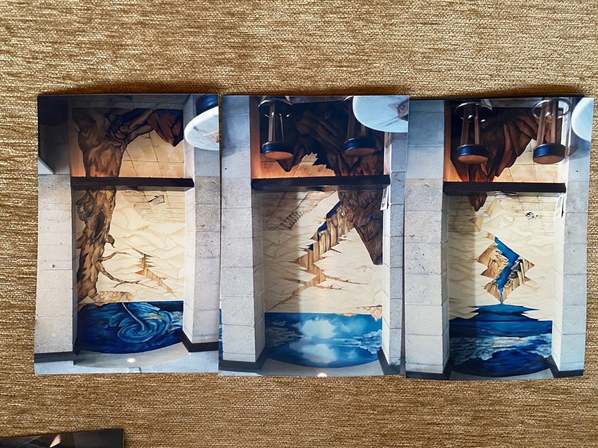 Mural in blue and white tones beside pallet seating