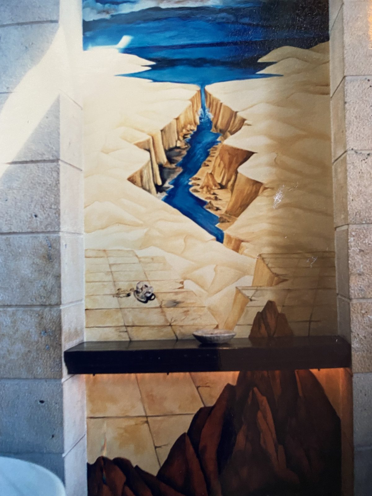 Mural painted on an exterior stone wall