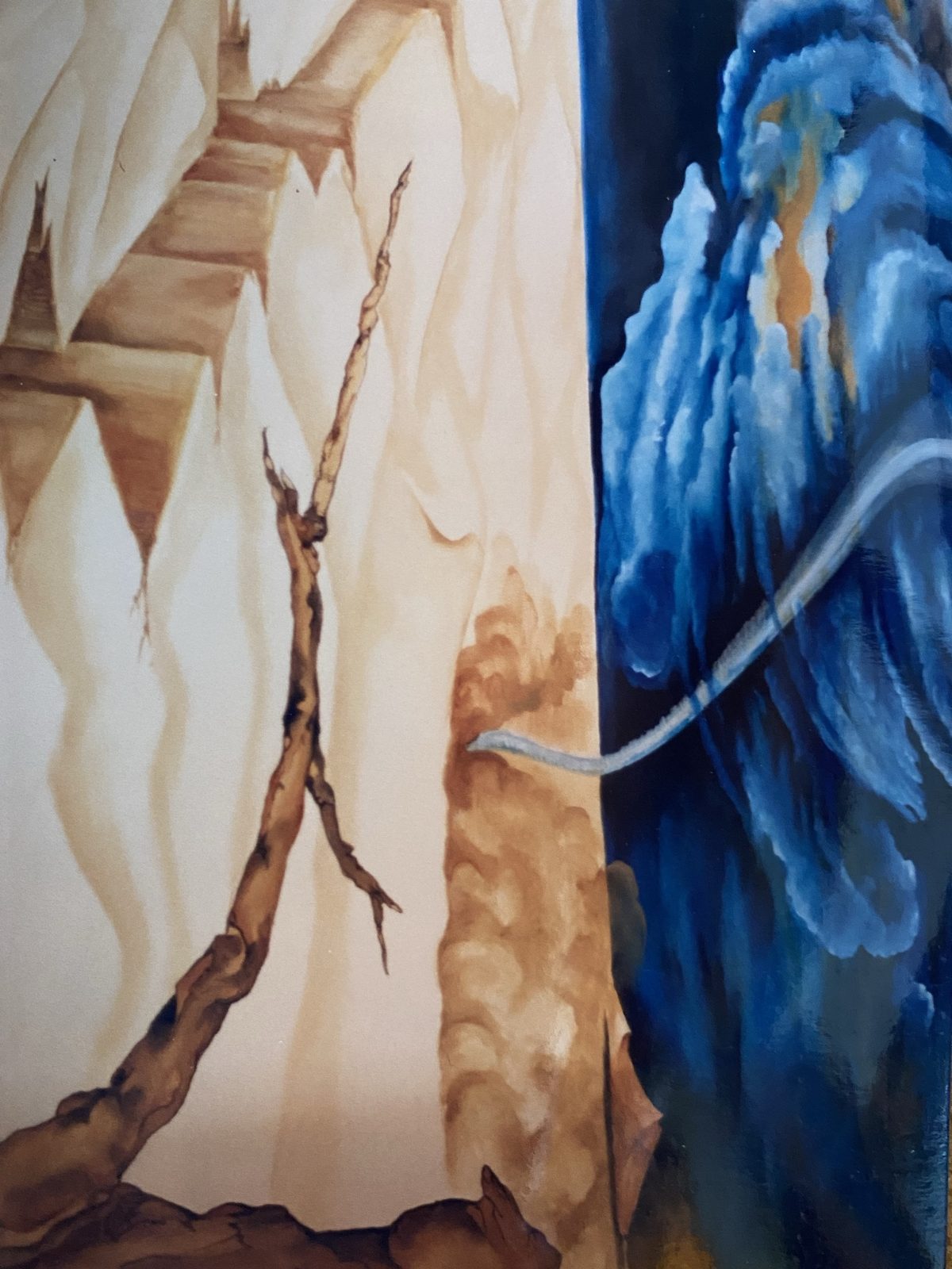 Mural detail: a cliff and arch over blue sea